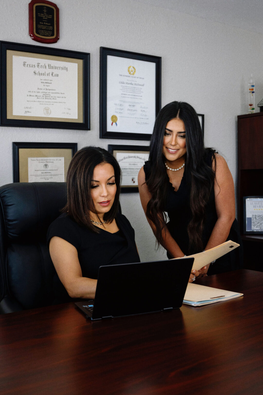 Gilda McDowell reviewing immigration strategy with a team member