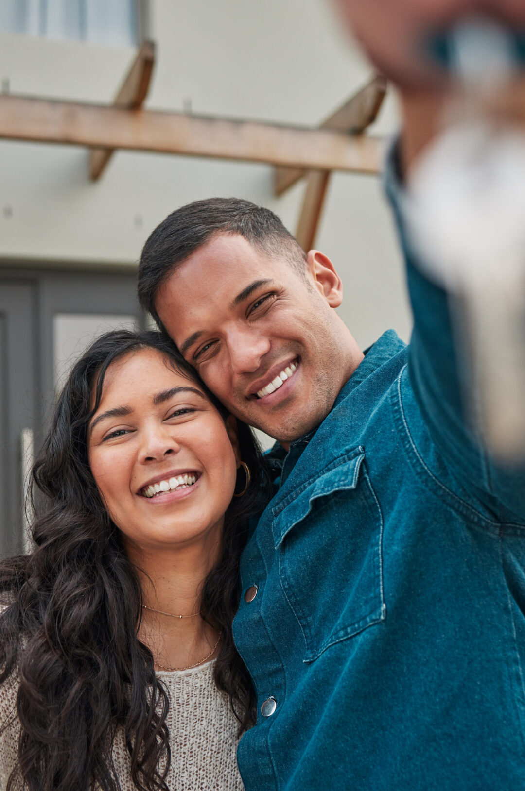 Engaged couple smiling together while planning their future