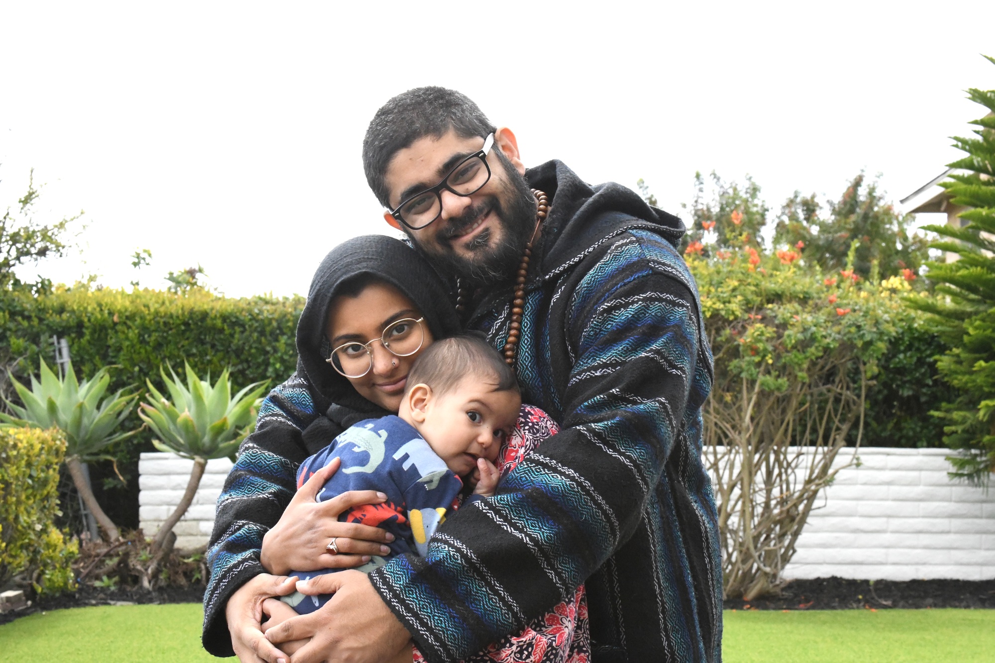 Happy young millennial ethnic modern Pakistani Muslim family