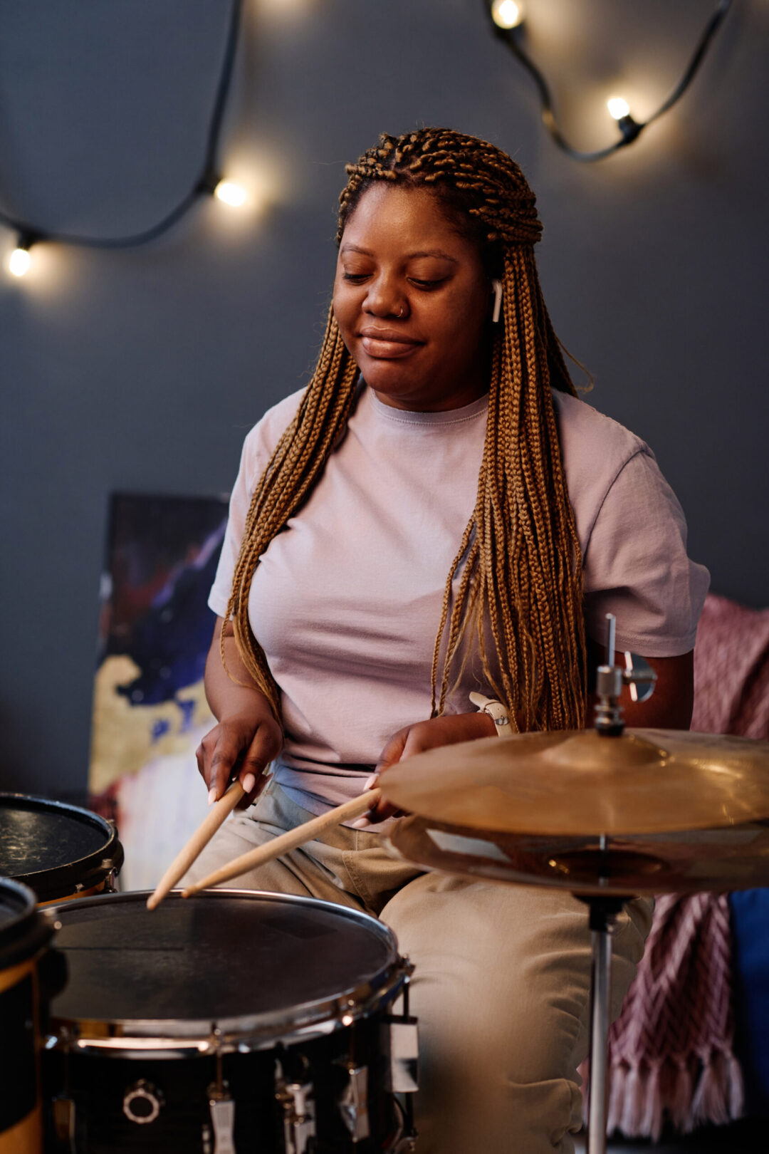 A professional drummer performing in a studio