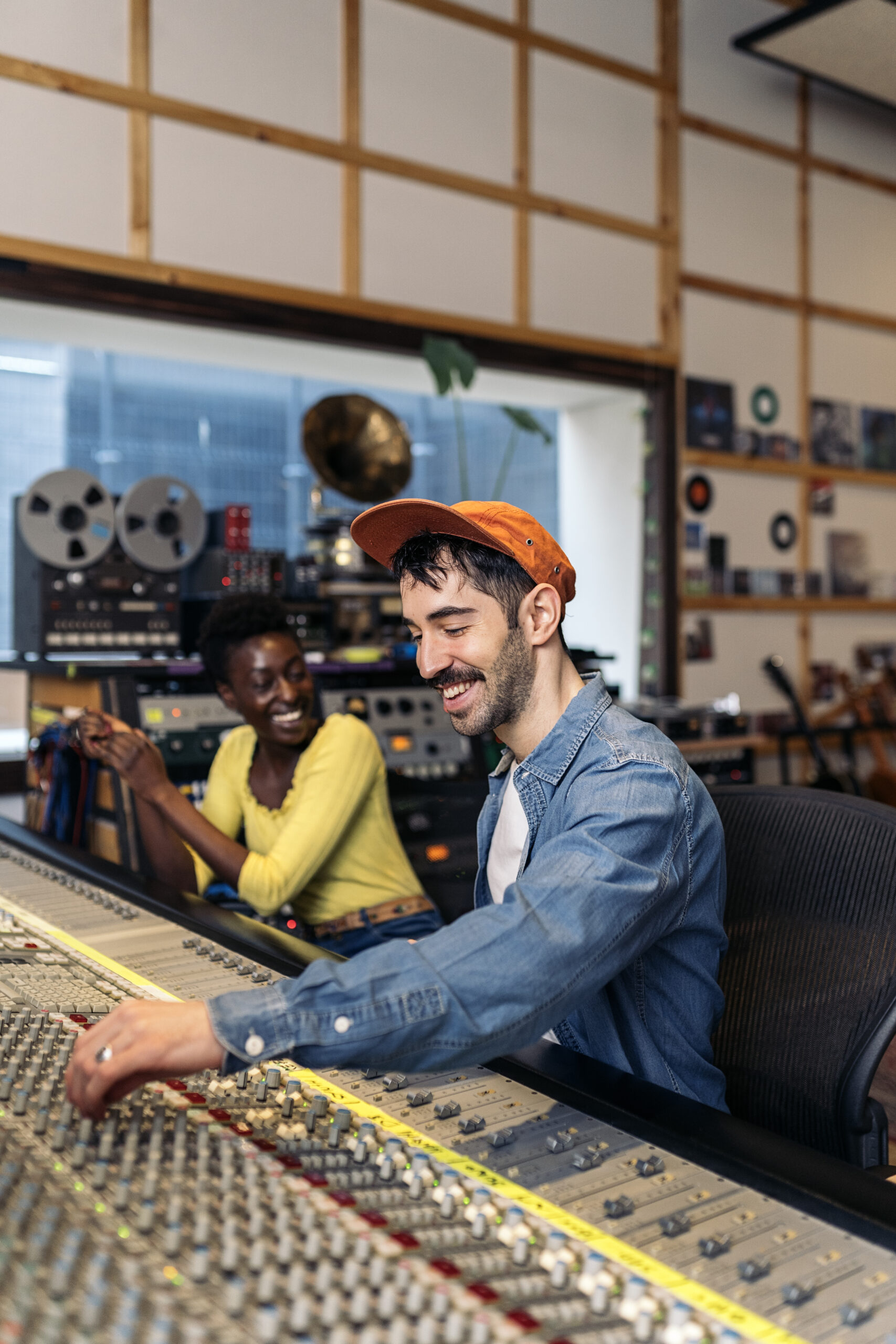 Music professionals working together in a recording studio