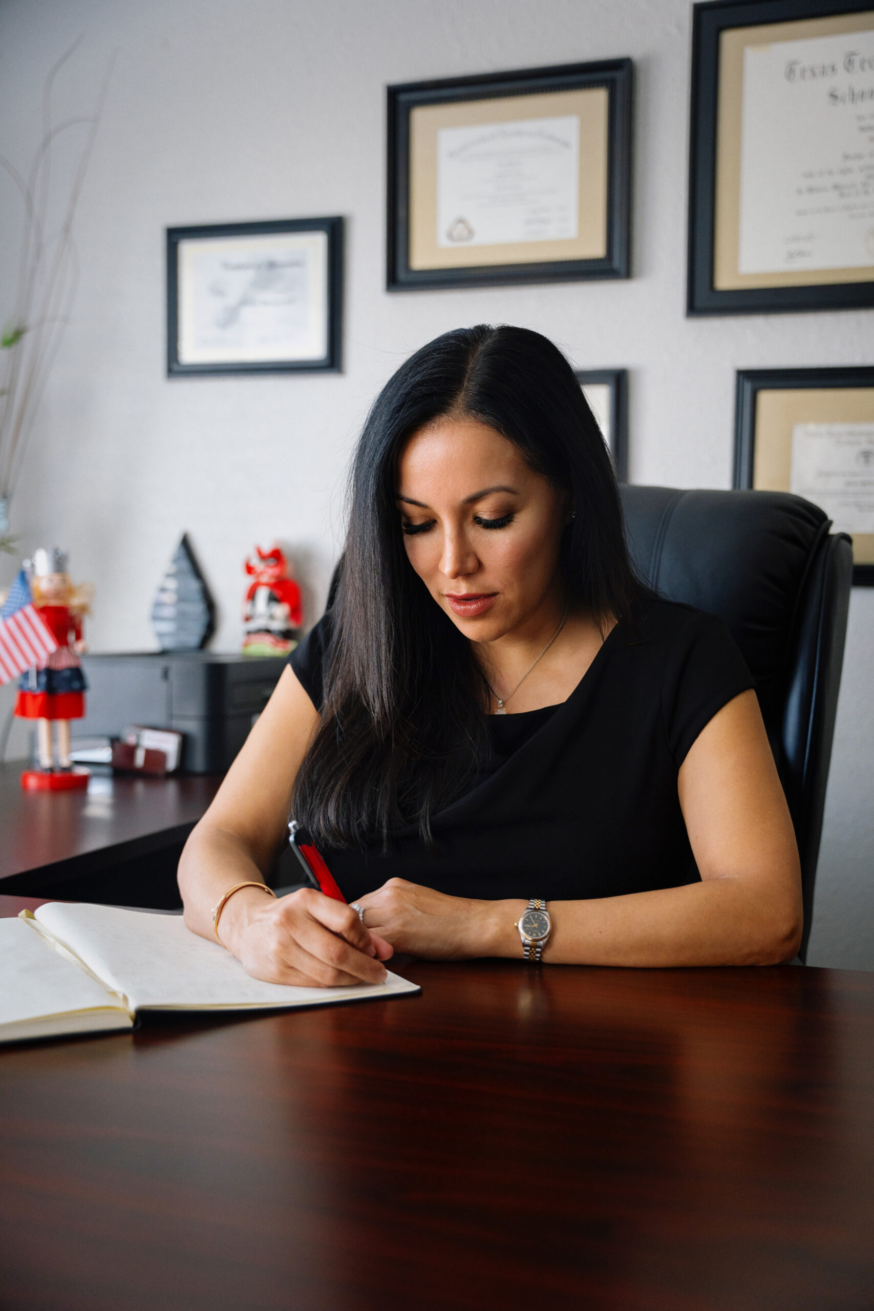 Immigration attorney Gilda McDowell reviewing legal work at her desk