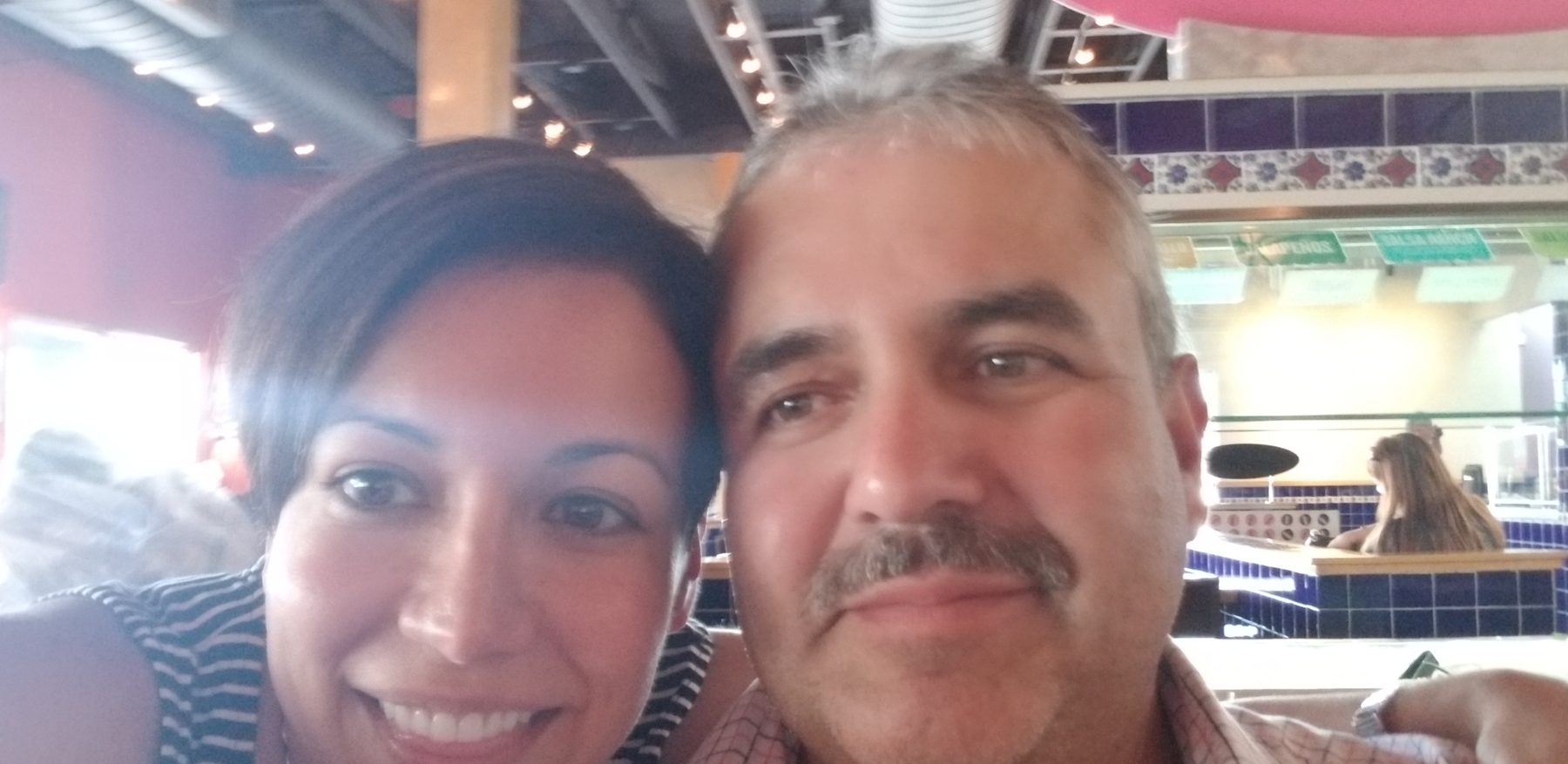 Gilda McDowell and her brother Gerardo celebrating at a restaurant the day his immigration case was approved