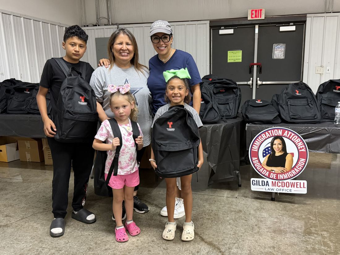 Children receiving free backpacks at a back to school giveaway in Lubbock