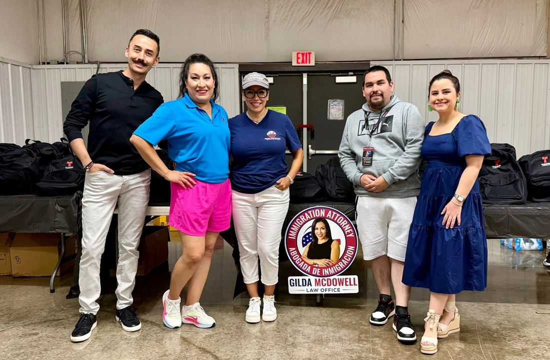 Local organizations volunteering together at a Lubbock backpack giveaway