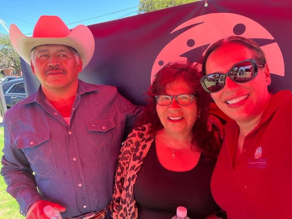 Gilda McDowell with longtime clients at a community gathering in Lubbock