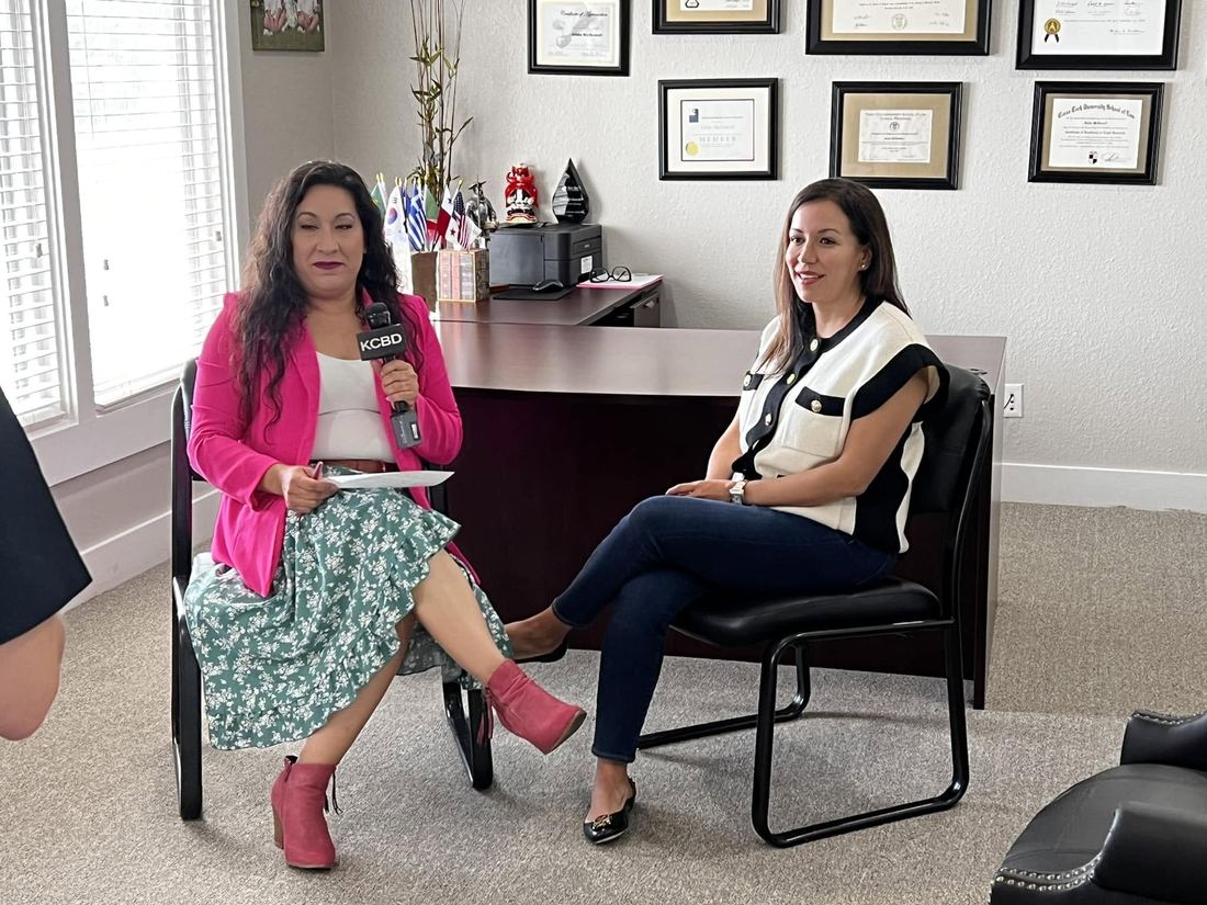 Gilda McDowell being interviewed on camera at her Lubbock law office